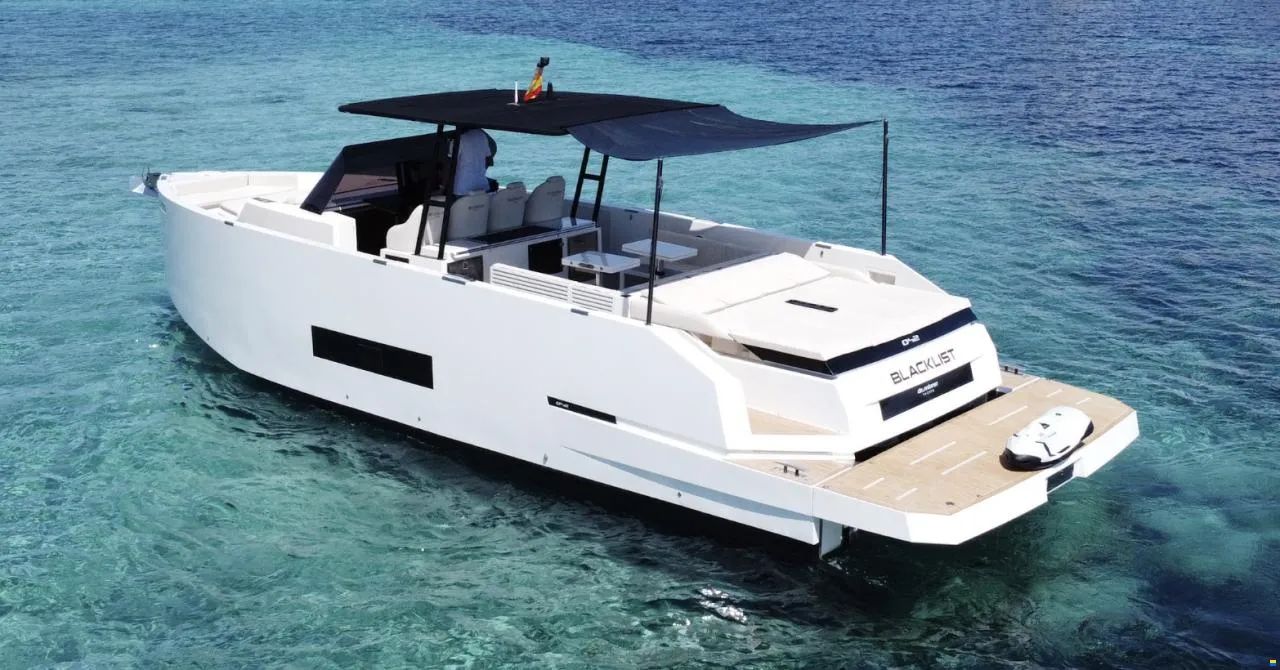 Blacklist D42 anchored in clear water off Ibiza