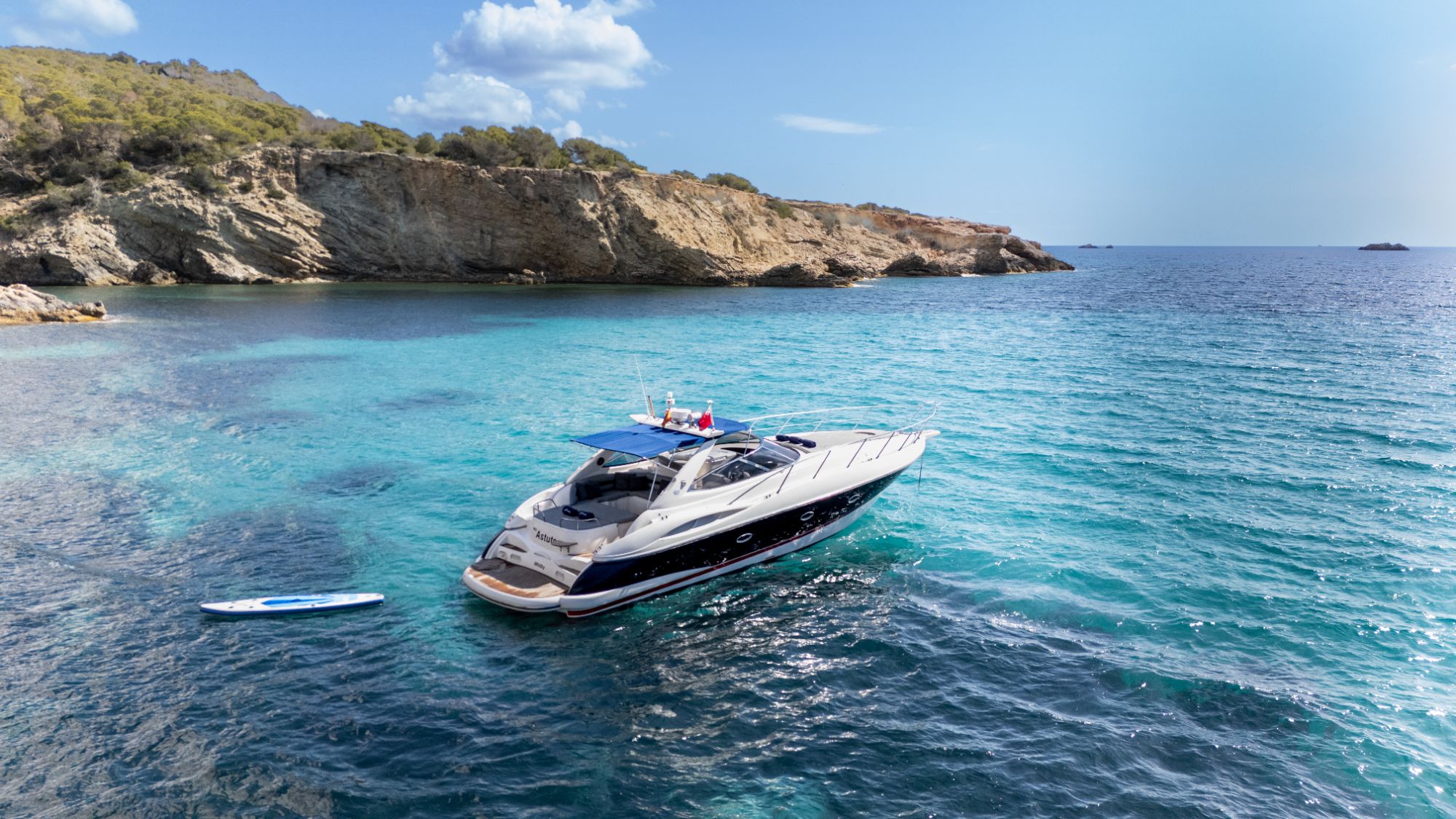 Sunseeker Camargue 47 Astute anchored in a cove off Ibiza