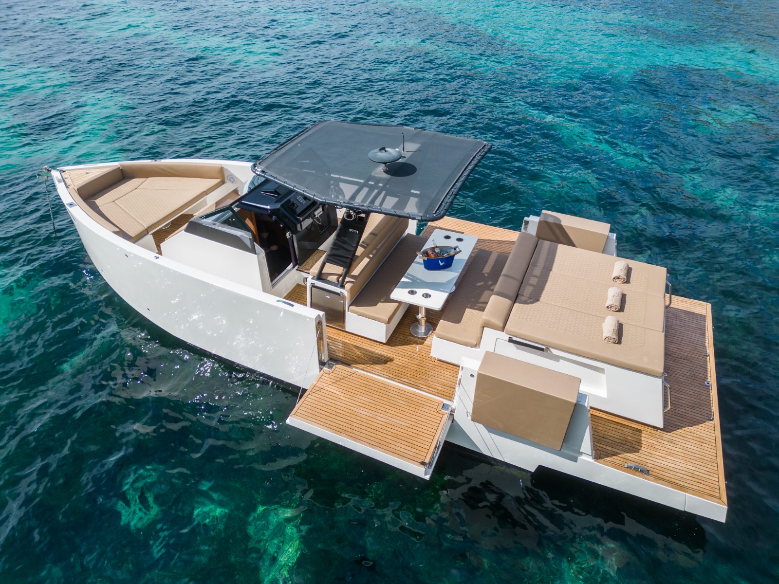 Fantasea D34 anchored in clear water off Ibiza