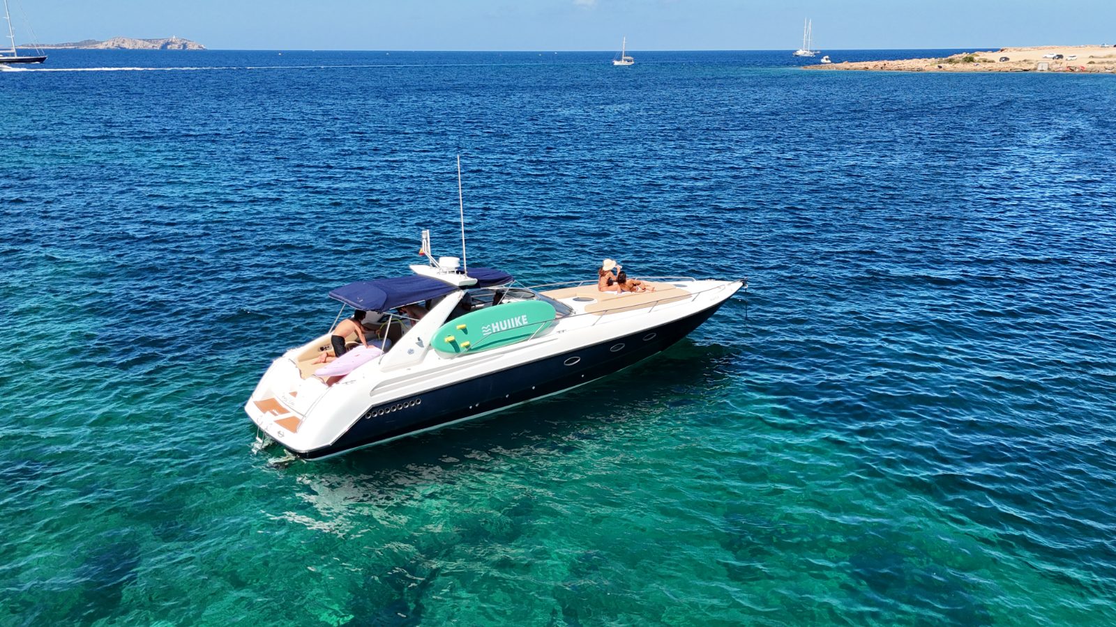 Pura Vida anchored in a cove off Ibiza