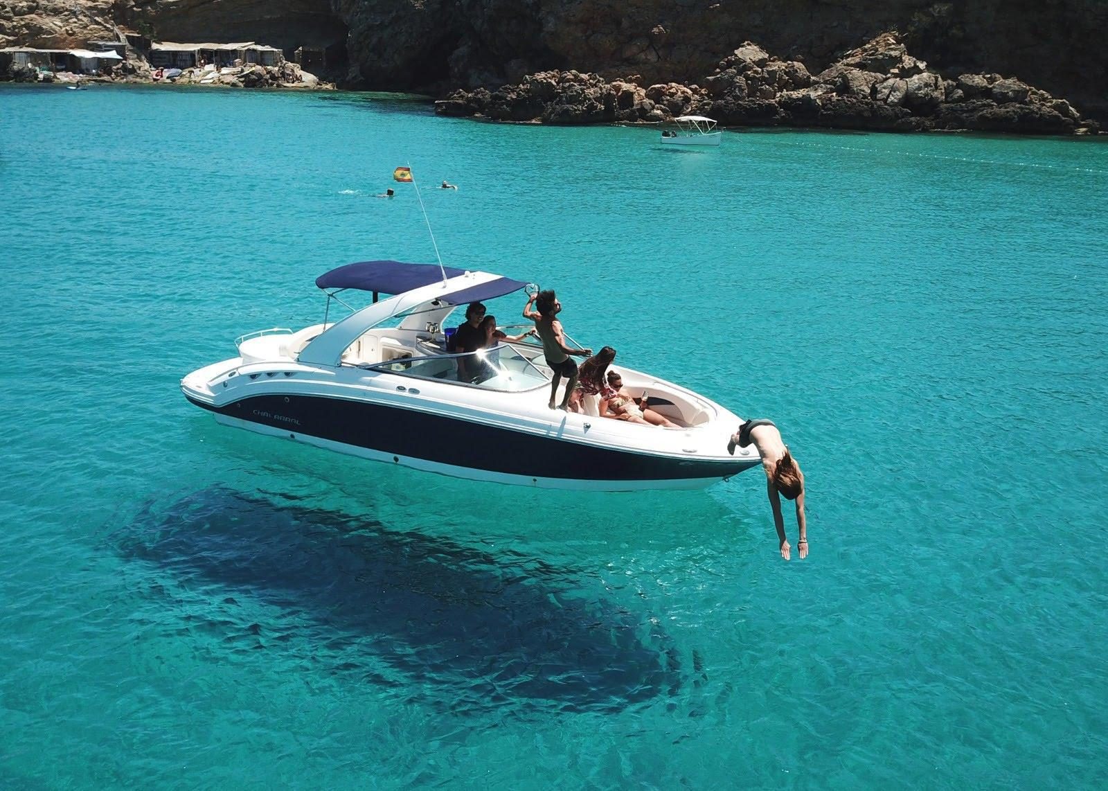 7-guest yacht anchored in a turquoise cove off Ibiza