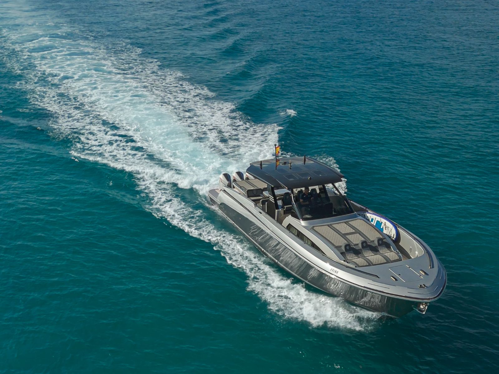 Canados Gladiator cutting across open water off Ibiza